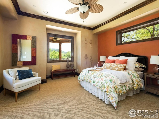 9840 Buckhorn Rd, Loveland, CO 80538 - bedroom with multiple windows, light colored carpet, baseboards, and ornamental molding