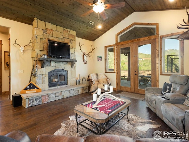 9840 Buckhorn Rd, Loveland, CO 80538 - living area with wood ceiling, vaulted ceiling, hardwood / wood-style flooring, a stone fireplace, and ceiling fan