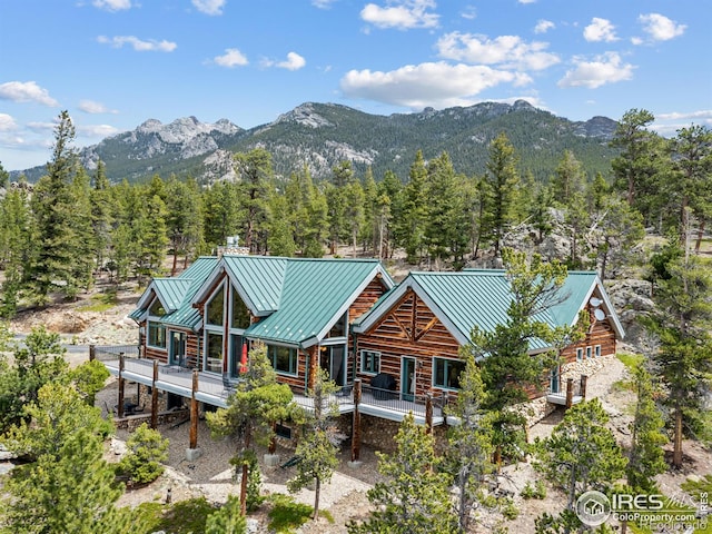 2430 Big Owl Rd, Allenspark, CO 80510 - back of property featuring a standing seam roof, a mountain view, and metal roof