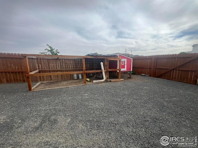 fenced backyard with exterior structure and an outdoor structure