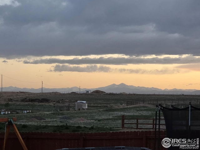view of mountain background featuring rural landscape