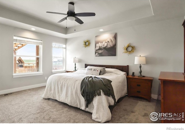 5063 Prairie Lark Ln, Severance, CO 80615 - carpeted bedroom with a raised ceiling, baseboards, recessed lighting, and ceiling fan