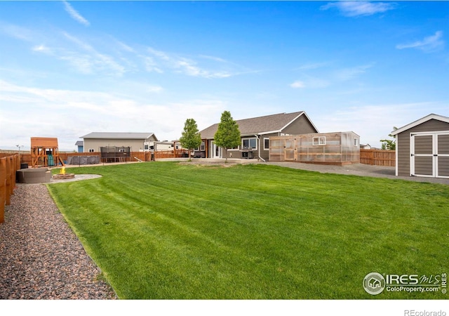 5063 Prairie Lark Ln, Severance, CO 80615 - view of yard with a greenhouse and a playground