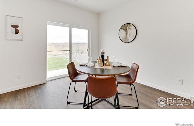 2727 73rd Ave, Greeley, CO 80634 - dining room featuring wood finished floors and baseboards