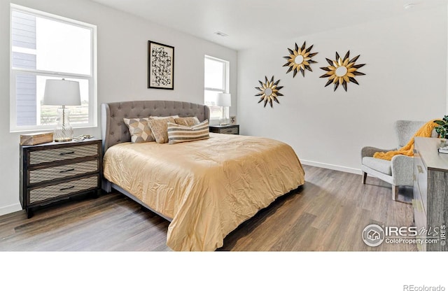 2727 73rd Ave, Greeley, CO 80634 - bedroom featuring wood finished floors and baseboards