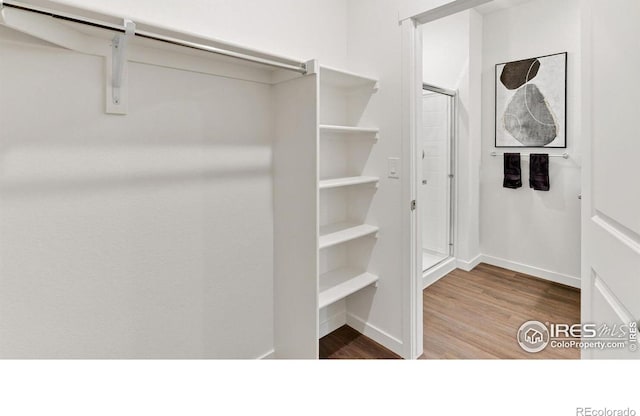 2727 73rd Ave, Greeley, CO 80634 - spacious closet featuring wood finished floors