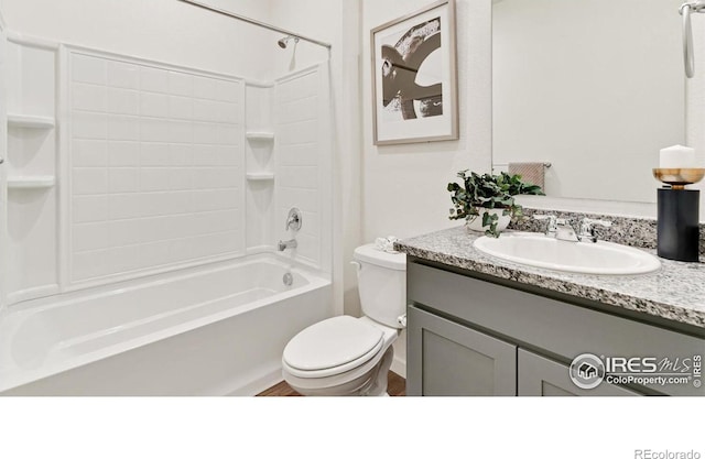 2727 73rd Ave, Greeley, CO 80634 - bathroom featuring toilet, vanity, and tub / shower combination