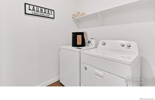 2727 73rd Ave, Greeley, CO 80634 - laundry area featuring washer and dryer, dark wood-style flooring, and baseboards