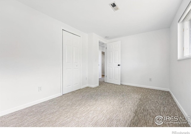 1350 Lehigh St, Boulder, CO 80305 - unfurnished bedroom featuring carpet flooring, a closet, and baseboards