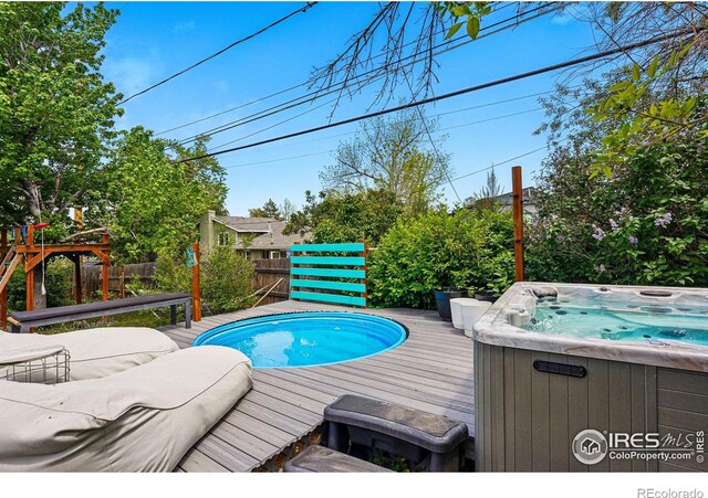 1350 Lehigh St, Boulder, CO 80305 - view of pool featuring a hot tub, a deck, and fence
