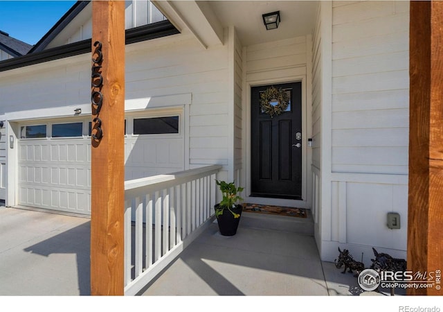 3593 Taylor Walker St, Loveland, CO 80537 - property entrance featuring a garage and concrete driveway