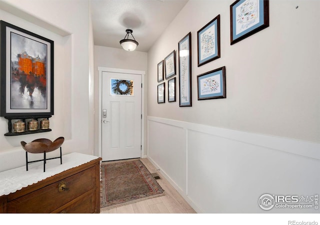 3593 Taylor Walker St, Loveland, CO 80537 - doorway to outside featuring light wood-style floors