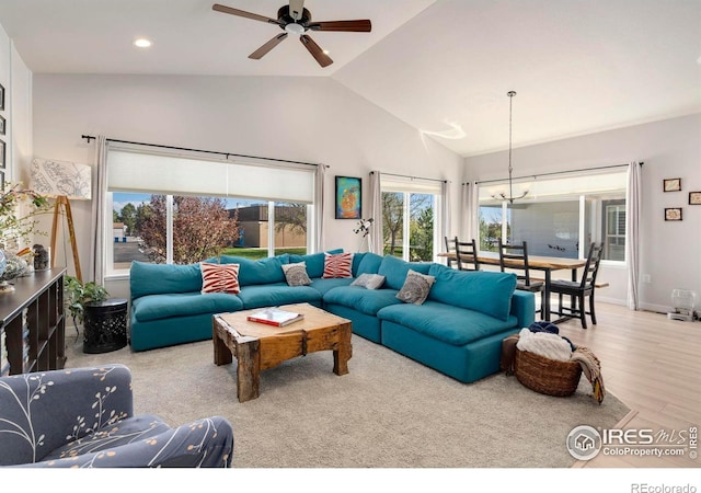 3593 Taylor Walker St, Loveland, CO 80537 - living room with lofted ceiling, wood finished floors, a chandelier, ceiling fan, and recessed lighting