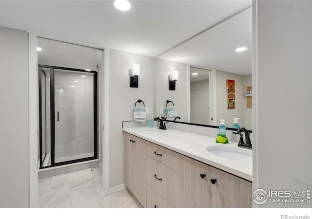 3593 Taylor Walker St, Loveland, CO 80537 - full bathroom featuring a stall shower, double vanity, recessed lighting, and baseboards