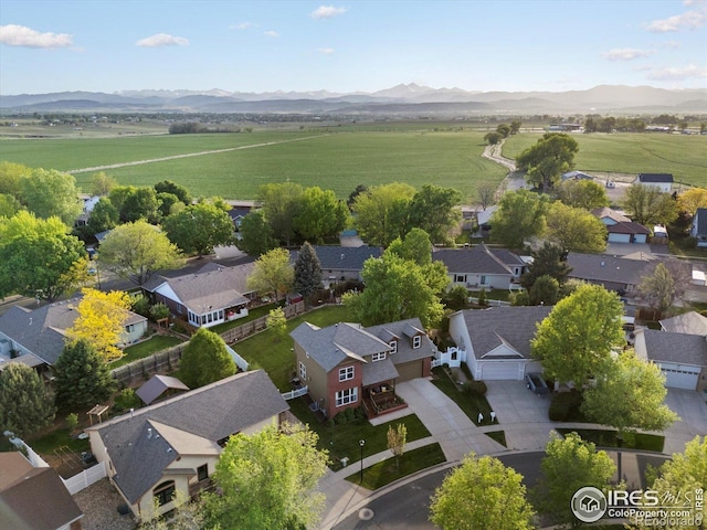 overview of rural landscape featuring a mountainous background and nearby suburban area