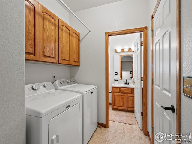 laundry room featuring cabinet space and separate washer and dryer