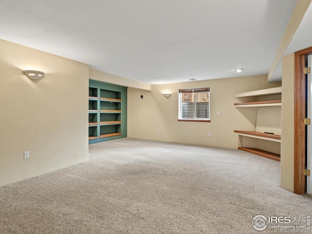 unfurnished living room with carpet floors