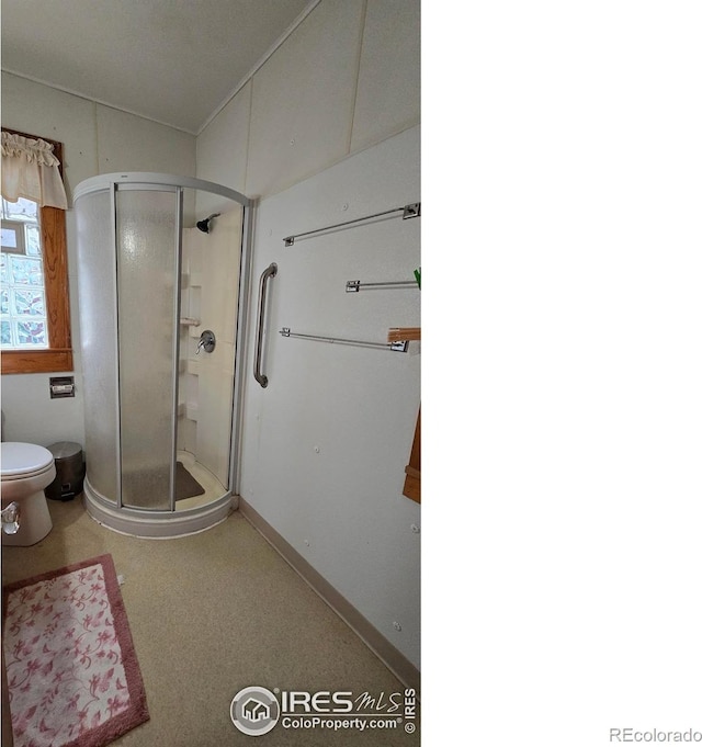 full bath with a shower stall and toilet