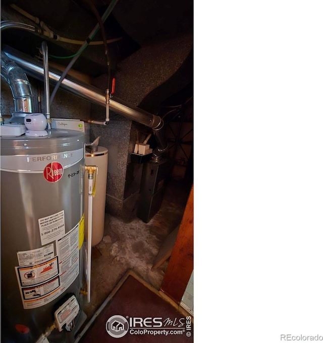 utility room featuring gas water heater