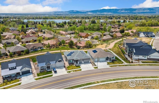 1721 Brightwater Dr, Fort Collins, CO 80524 - aerial perspective of suburban area with a water and mountain view