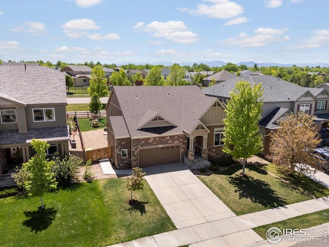 950 Sumner Way, Erie, CO 80516 - view of front of property featuring a residential view, driveway, a garage, and board and batten siding