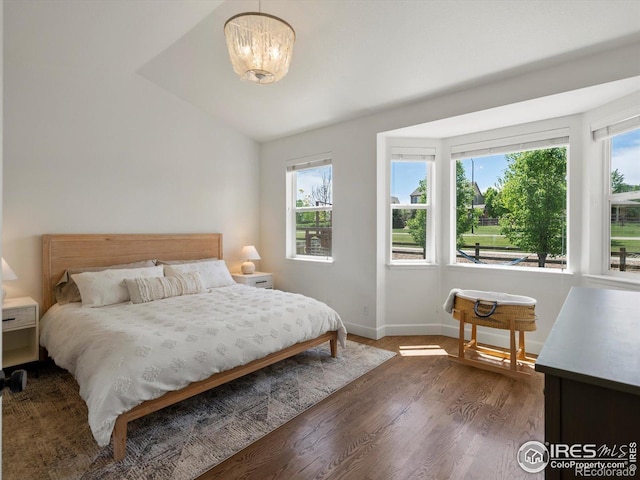 950 Sumner Way, Erie, CO 80516 - bedroom with wood finished floors, vaulted ceiling, and baseboards