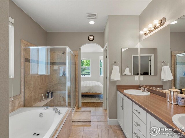 950 Sumner Way, Erie, CO 80516 - full bathroom with a shower stall, double vanity, a garden tub, and connected bathroom