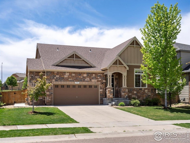 950 Sumner Way, Erie, CO 80516 - craftsman-style house featuring stone siding, driveway, board and batten siding, a garage, and roof with shingles