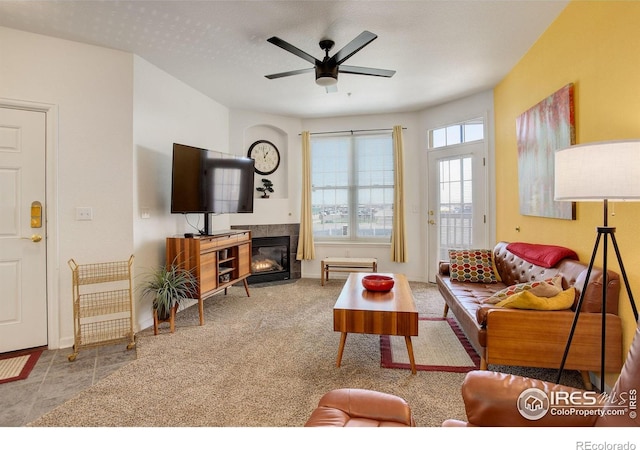 5723 N Gibralter Way Unit 205, Aurora, CO 80019 - living room with ceiling fan, baseboards, a fireplace, and carpet floors