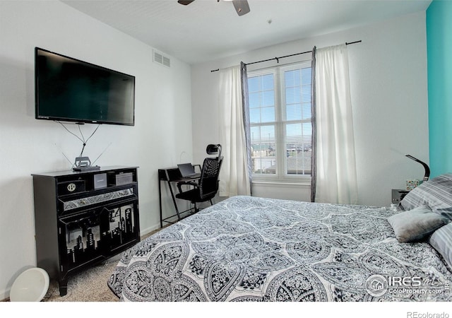 5723 N Gibralter Way Unit 205, Aurora, CO 80019 - bedroom featuring baseboards, carpet floors, and a ceiling fan