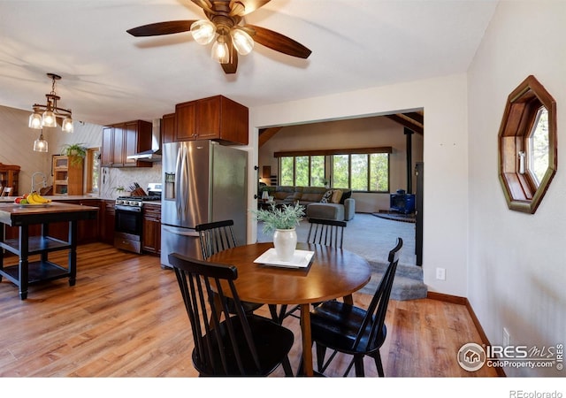 40 Hopi Ct, Lyons, CO 80540 - dining space with ceiling fan, light wood finished floors, and baseboards