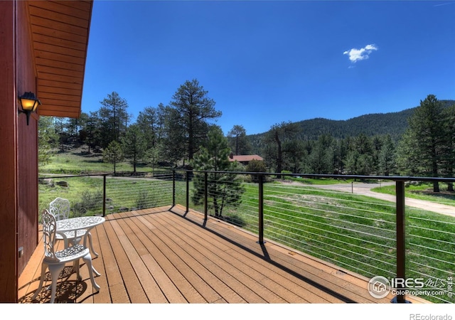 40 Hopi Ct, Lyons, CO 80540 - deck with a view of trees and a mountain view