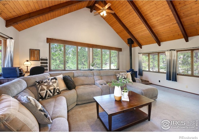 40 Hopi Ct, Lyons, CO 80540 - living room with a wood stove, wooden ceiling, high vaulted ceiling, carpet flooring, and beam ceiling