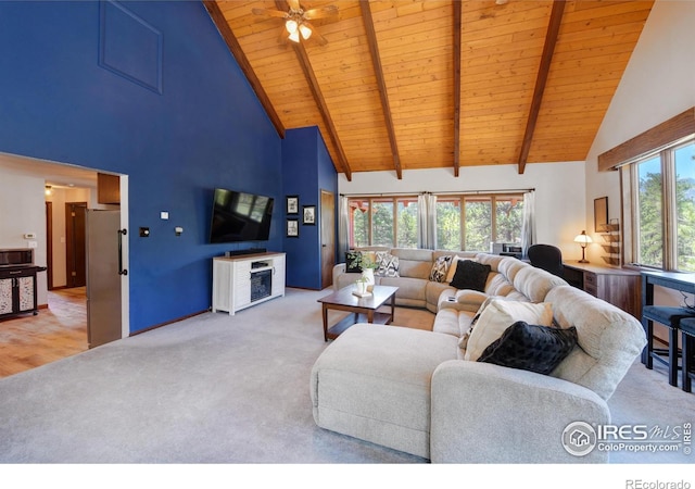 40 Hopi Ct, Lyons, CO 80540 - living area featuring high vaulted ceiling, wood ceiling, carpet floors, ceiling fan, and beamed ceiling