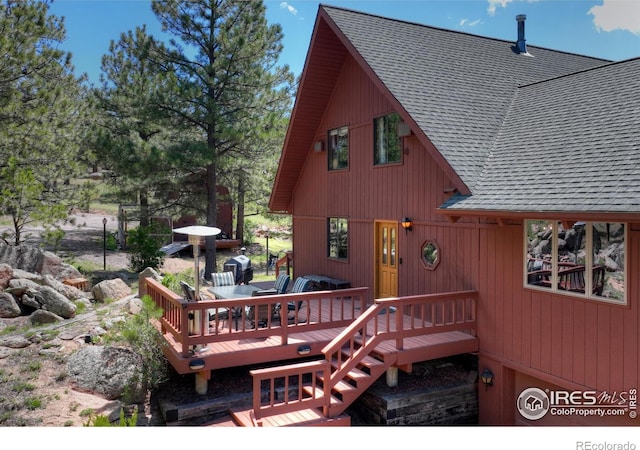 40 Hopi Ct, Lyons, CO 80540 - rear view of property with a shingled roof and a deck