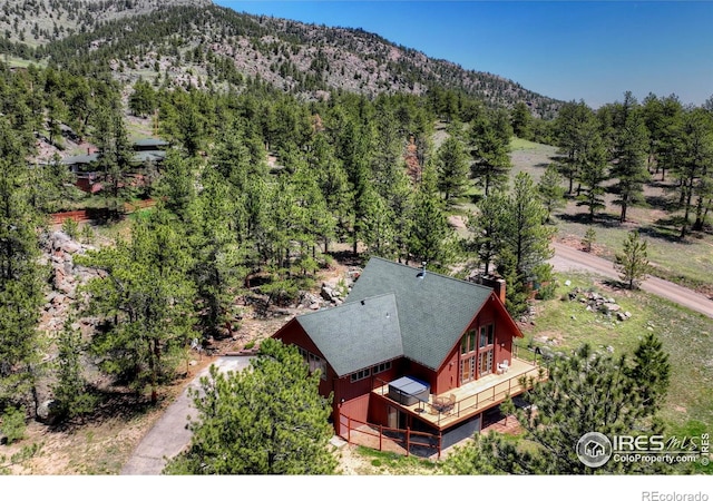 40 Hopi Ct, Lyons, CO 80540 - aerial view of property and surrounding area with a mountain backdrop and a forest