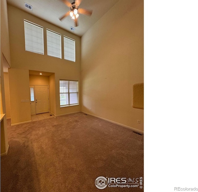 6608 W 3rd St Unit 35-58, Greeley, CO 80634 - unfurnished living room with a ceiling fan, carpet flooring, and baseboards