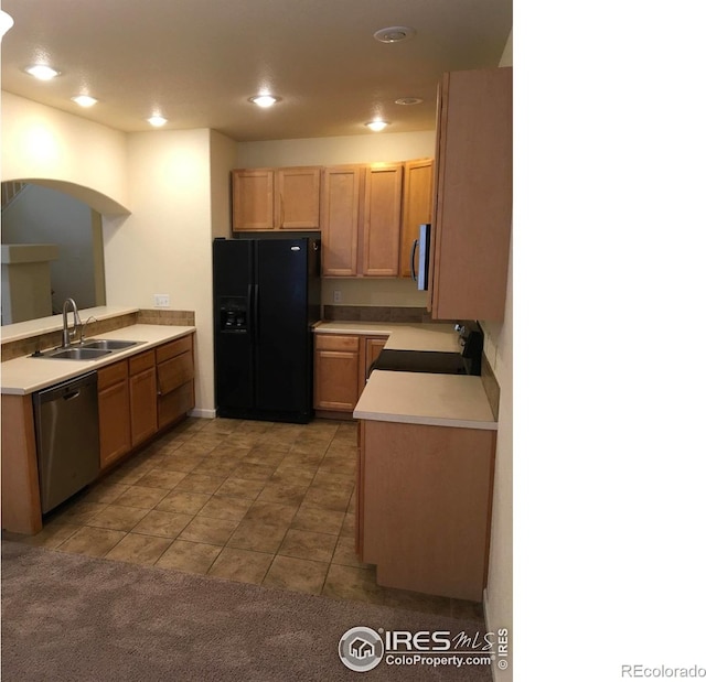 6608 W 3rd St Unit 35-58, Greeley, CO 80634 - kitchen with appliances with stainless steel finishes, a sink, light tile patterned floors, light countertops, and a peninsula