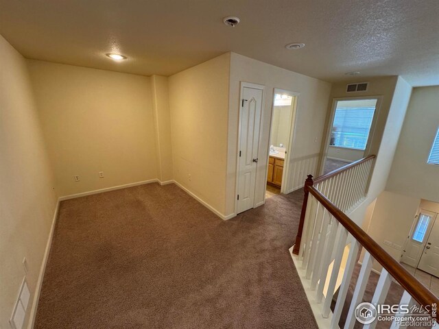 6608 W 3rd St Unit 35-58, Greeley, CO 80634 - carpeted empty room with baseboards, a textured ceiling, and recessed lighting