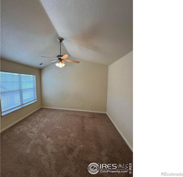 6608 W 3rd St Unit 35-58, Greeley, CO 80634 - carpeted empty room featuring vaulted ceiling, a ceiling fan, a textured ceiling, and baseboards