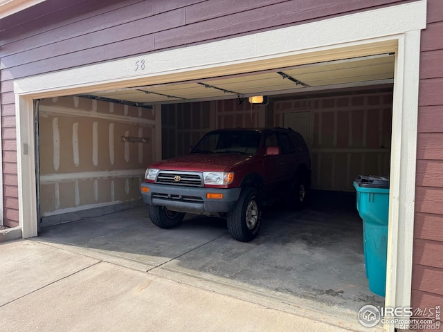 6608 W 3rd St Unit 35-58, Greeley, CO 80634 - garage featuring driveway and a garage door opener