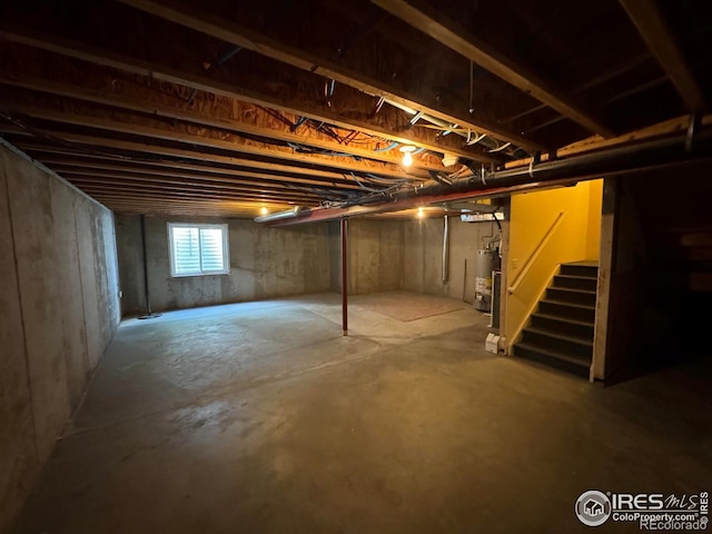 6608 W 3rd St Unit 35-58, Greeley, CO 80634 - below grade area featuring stairs and gas water heater