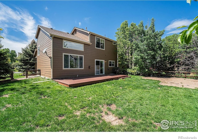 rear view of house featuring a deck