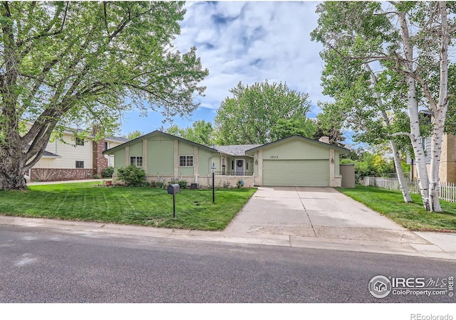 single story home with a garage and concrete driveway