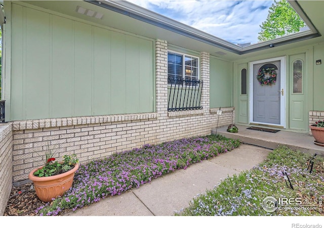 entrance to property with brick siding