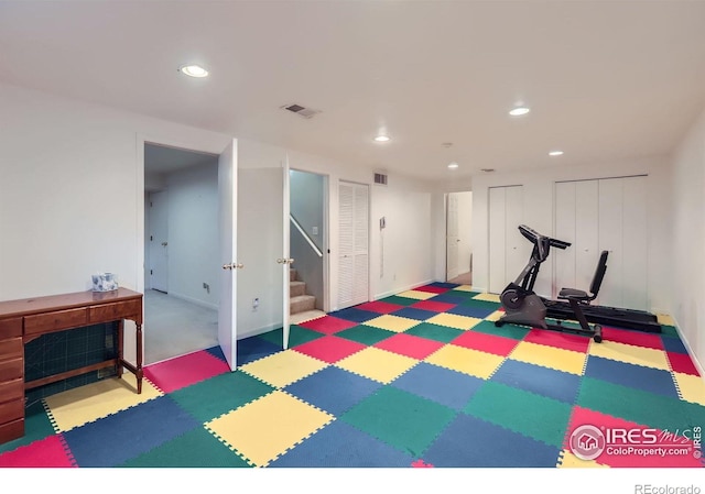 exercise room with recessed lighting, baseboards, and tile patterned floors