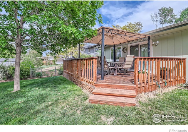 wooden deck featuring outdoor dining space and a gazebo