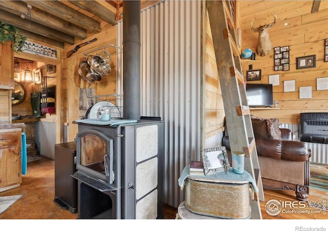 1095 Spruce Mountain Dr, Drake, CO 80515 - detailed view of wooden walls, a wood stove, and heating unit