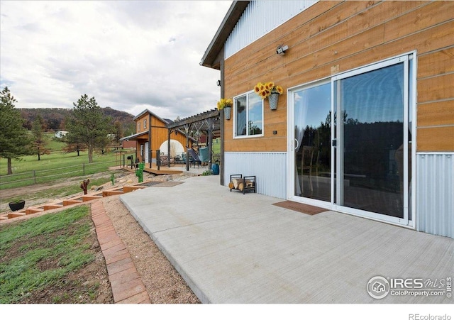 1095 Spruce Mountain Dr, Drake, CO 80515 - view of patio with a wooden deck and fence