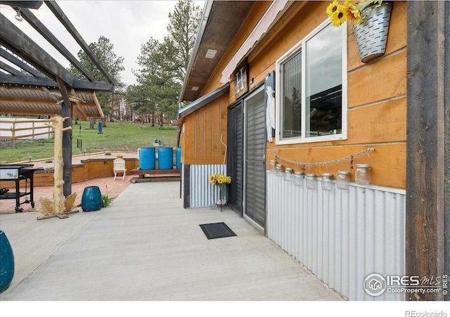1095 Spruce Mountain Dr, Drake, CO 80515 - view of side of home with a patio